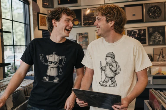 Two white European-American friends wearing original playful graphics