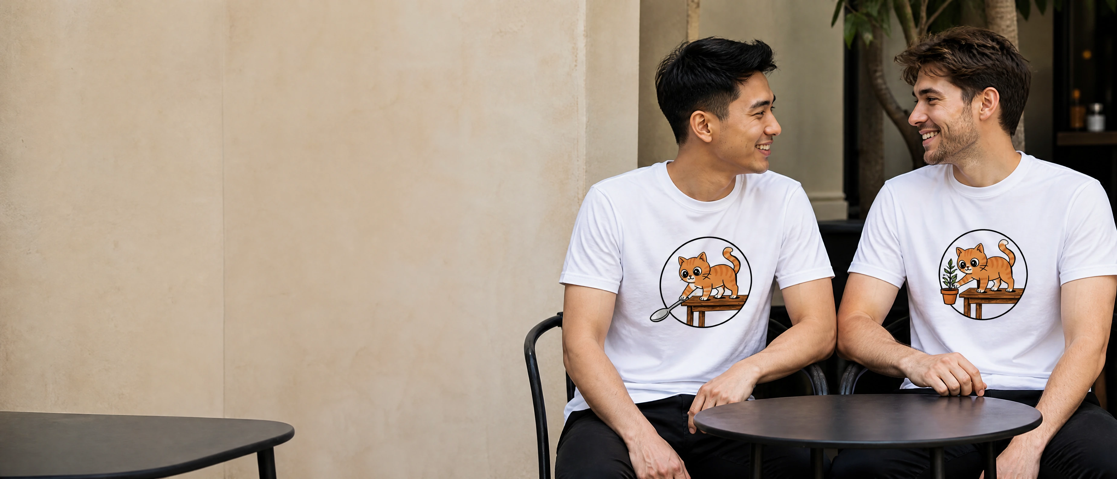 Two young adults wearing playful graphic T-shirts